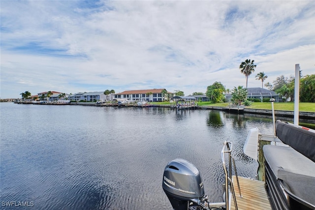 dock area featuring a water view and a residential view