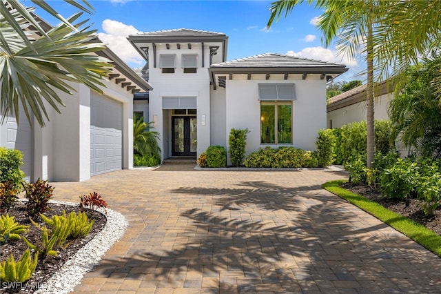 view of front of house featuring french doors and a garage