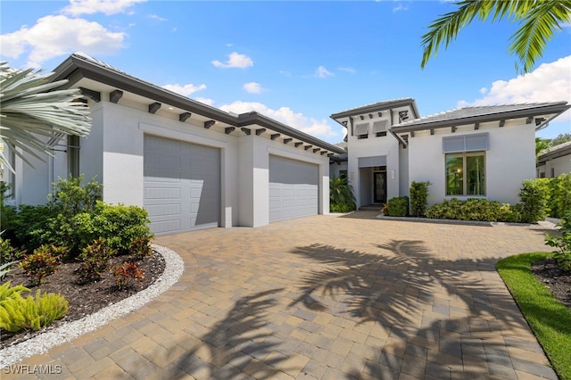 mediterranean / spanish home featuring a garage