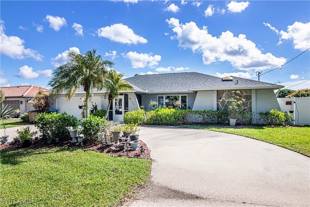 single story home with a front lawn and a garage