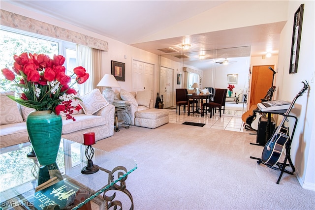 living room with vaulted ceiling, light carpet, and ceiling fan