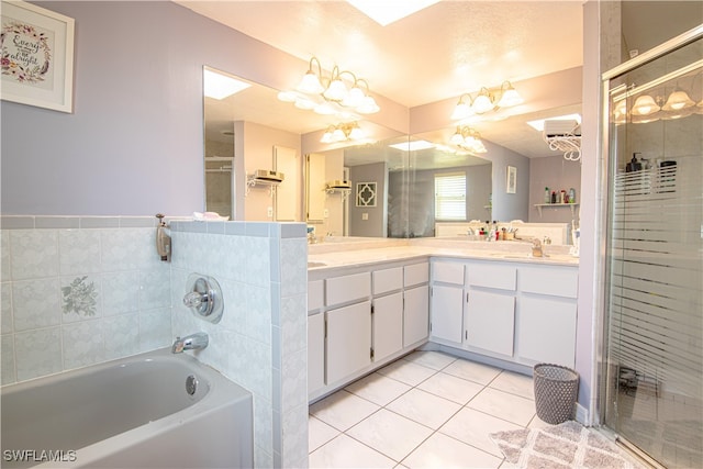 bathroom featuring vanity, a notable chandelier, tile patterned floors, and independent shower and bath