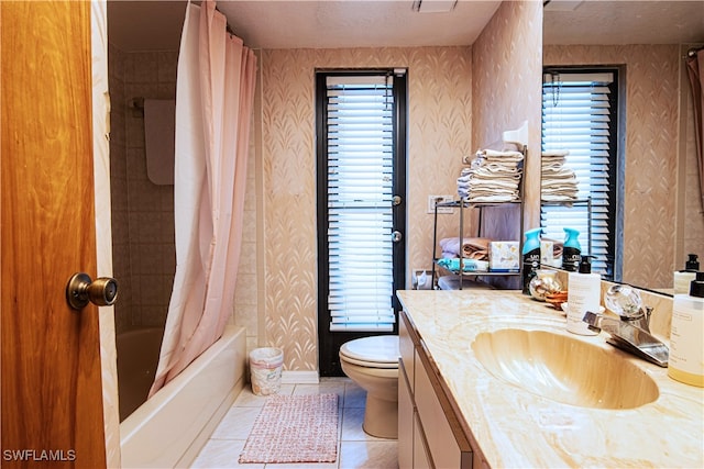 full bathroom featuring shower / bath combination with curtain, toilet, tile patterned flooring, and vanity