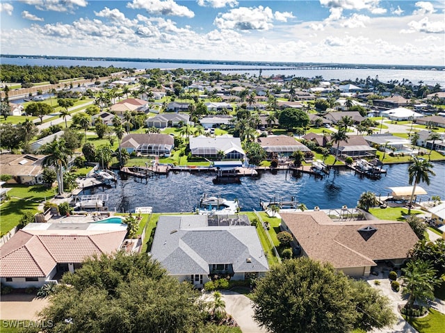 drone / aerial view with a water view