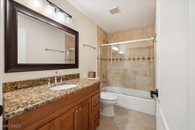 full bathroom with vanity, shower / bath combination with glass door, toilet, and tile patterned floors