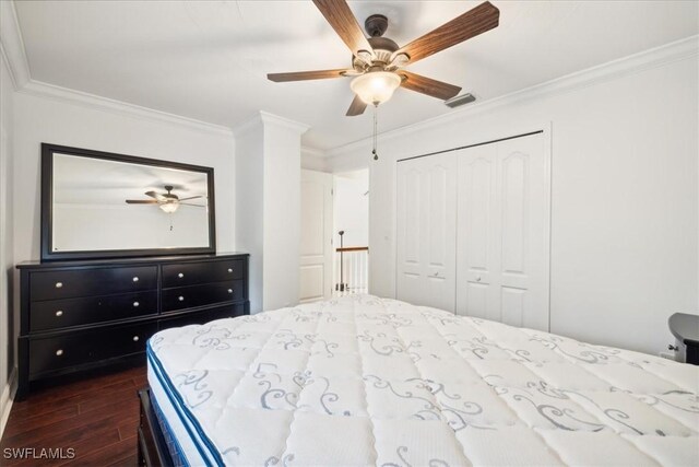 15621 Red Fox Run, Fort Myers, FL 33912 - bedroom featuring dark wood-type flooring, crown molding, a closet, and ceiling fan