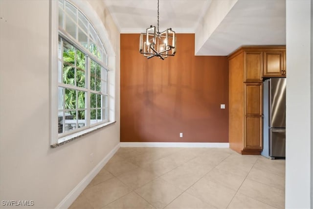 15621 Red Fox Run, Fort Myers, FL 33912 - unfurnished dining area featuring a chandelier, light tile patterned floors, and ornamental molding