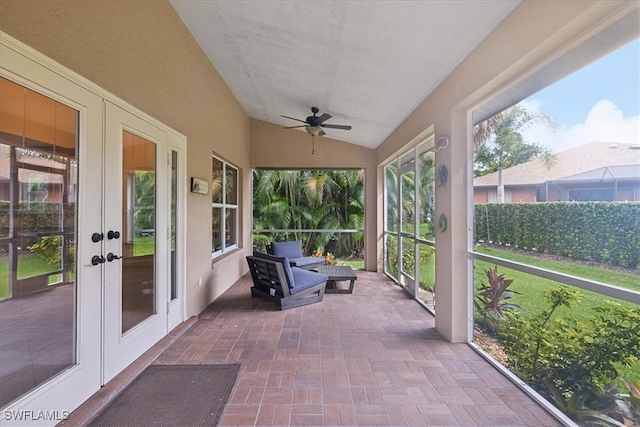 unfurnished sunroom with french doors, ceiling fan, and vaulted ceiling