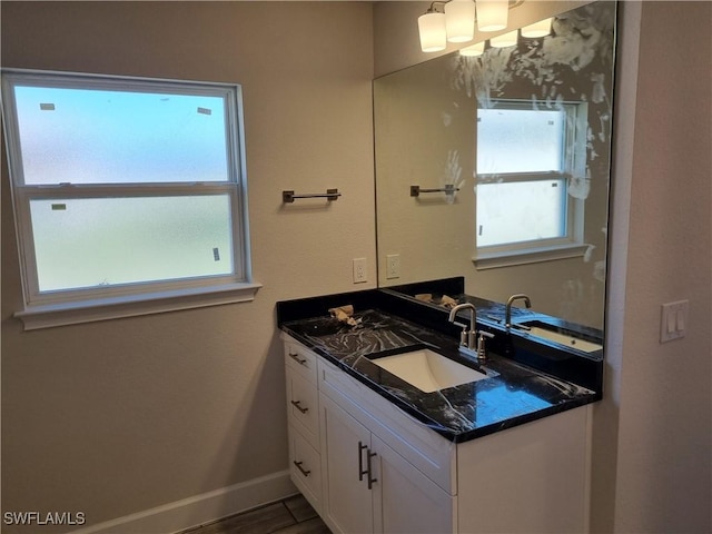 bathroom featuring vanity and hardwood / wood-style floors