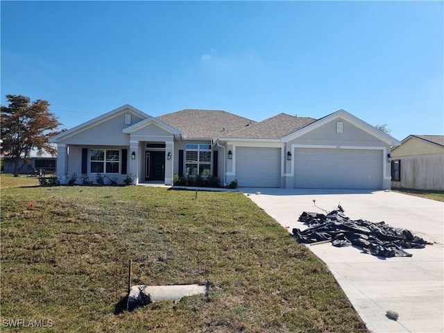 view of front facade featuring a garage and a front lawn