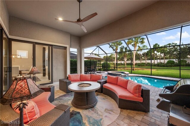12917 Hadley Ct, Fort Myers, FL 33913 - view of patio with an outdoor living space with a fire pit, a pool with connected hot tub, glass enclosure, and a ceiling fan