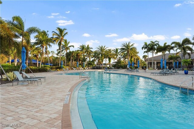 12917 Hadley Ct, Fort Myers, FL 33913 - community pool featuring a patio