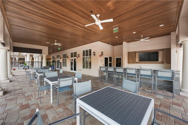 12917 Hadley Ct, Fort Myers, FL 33913 - view of patio / terrace featuring ceiling fan, outdoor dining area, and a bar