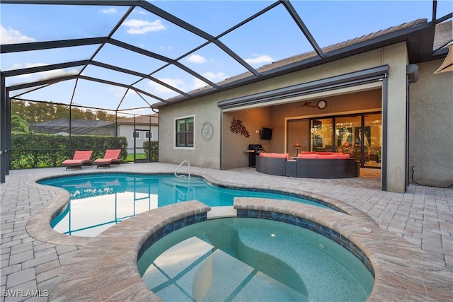 12917 Hadley Ct, Fort Myers, FL 33913 - view of pool featuring a patio, a pool with connected hot tub, an outdoor hangout area, and glass enclosure