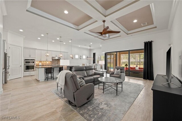 12917 Hadley Ct, Fort Myers, FL 33913 - living room with coffered ceiling, a ceiling fan, ornamental molding, and beam ceiling