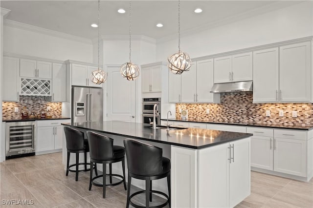 12917 Hadley Ct, Fort Myers, FL 33913 - kitchen with beverage cooler, appliances with stainless steel finishes, dark countertops, ornamental molding, and under cabinet range hood