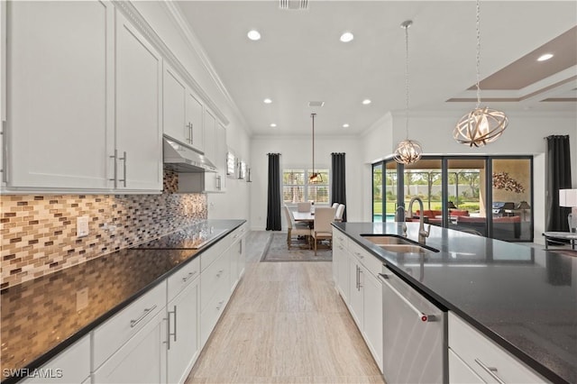 12917 Hadley Ct, Fort Myers, FL 33913 - kitchen with dishwasher, a sink, under cabinet range hood, black electric cooktop, and a chandelier