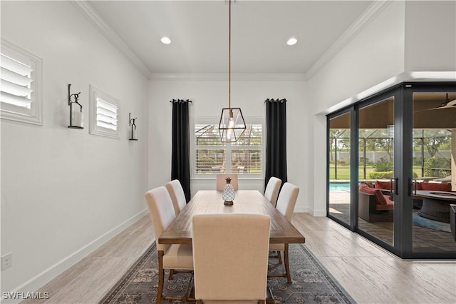 12917 Hadley Ct, Fort Myers, FL 33913 - dining room with french doors, crown molding, recessed lighting, baseboards, and wood finished floors