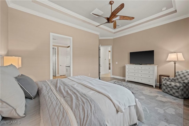 12917 Hadley Ct, Fort Myers, FL 33913 - bedroom featuring a tray ceiling, ornamental molding, wood finished floors, baseboards, and a ceiling fan