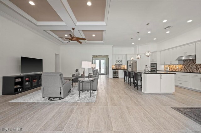12917 Hadley Ct, Fort Myers, FL 33913 - living area featuring crown molding, recessed lighting, coffered ceiling, and beamed ceiling