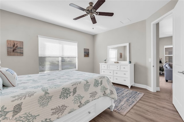 bedroom featuring light hardwood / wood-style flooring and ceiling fan