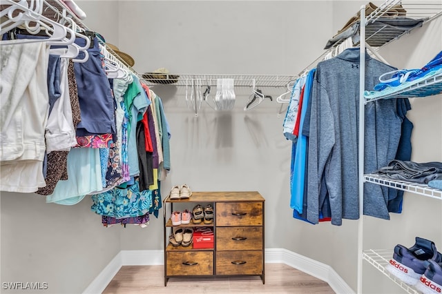 spacious closet featuring hardwood / wood-style floors