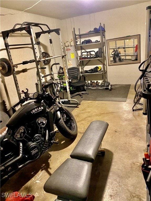 interior space featuring water heater and concrete flooring