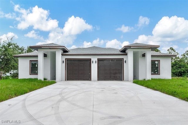 prairie-style house featuring a garage