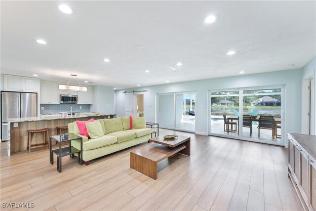 living room with light hardwood / wood-style flooring