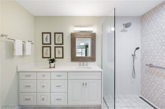 bathroom featuring a shower and vanity