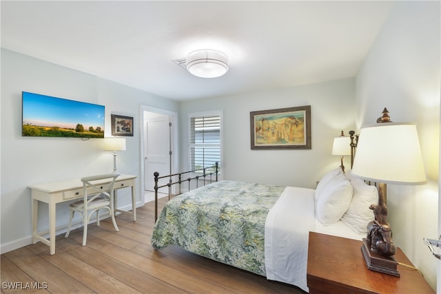 bedroom featuring hardwood / wood-style flooring