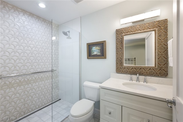 bathroom featuring an AC wall unit, tiled shower, vanity, and toilet