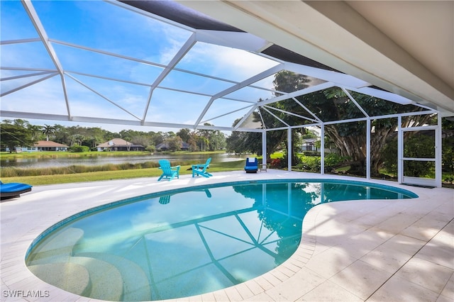 view of pool featuring a lanai, a water view, and a patio area