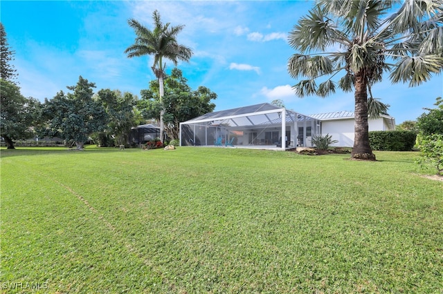 view of yard with a lanai