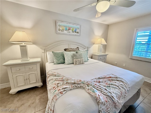 bedroom featuring tile patterned floors and ceiling fan