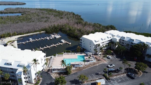 birds eye view of property with a water view