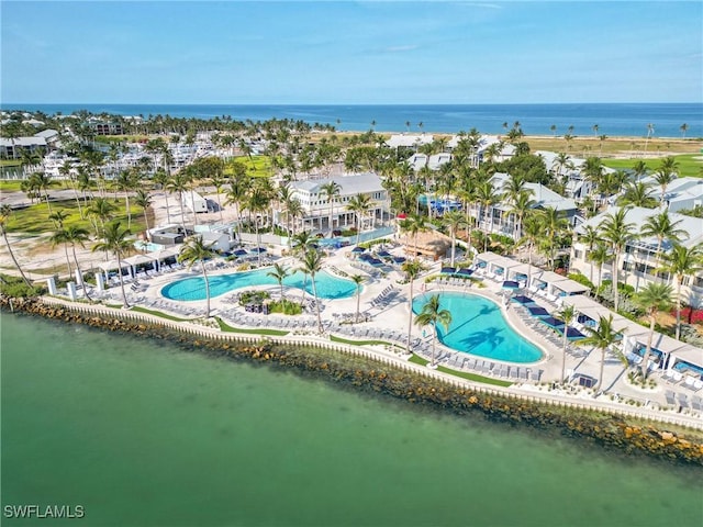 birds eye view of property with a water view