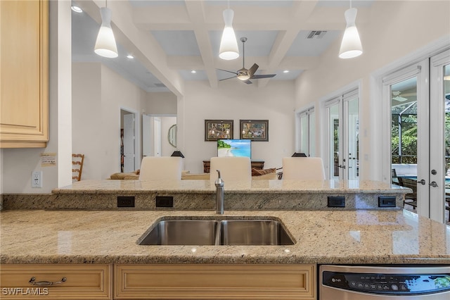 kitchen with coffered ceiling, pendant lighting, beam ceiling, ceiling fan, and french doors