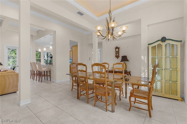 dining area featuring a notable chandelier, light tile patterned flooring, and crown molding