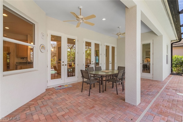 view of patio / terrace featuring ceiling fan and french doors