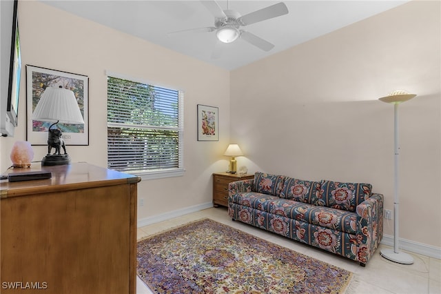 interior space with light tile patterned floors and ceiling fan