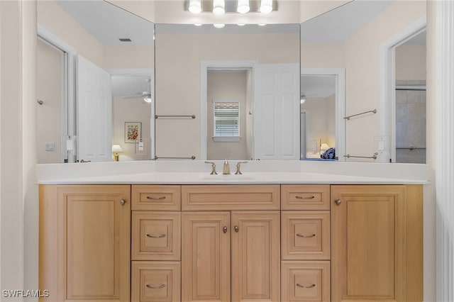 bathroom featuring ceiling fan and vanity