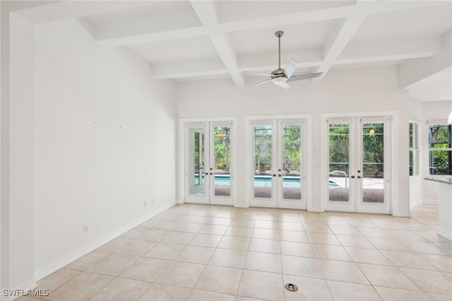 unfurnished room featuring french doors, coffered ceiling, beamed ceiling, ceiling fan, and light tile patterned floors
