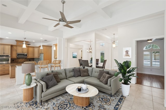 living room with coffered ceiling, light tile patterned floors, a ceiling fan, beam ceiling, and recessed lighting