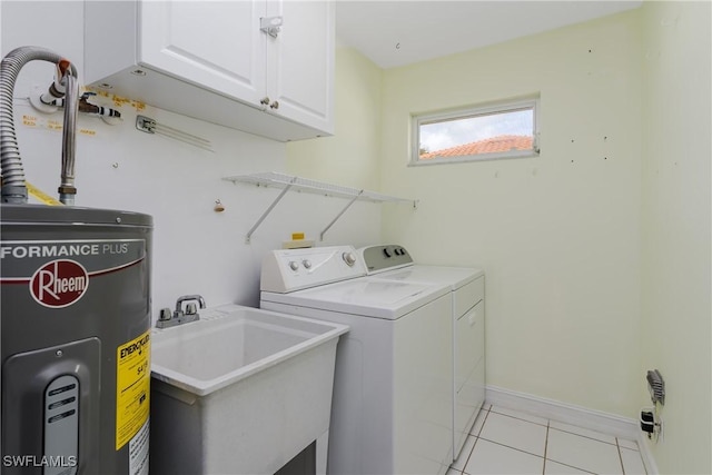 washroom with sink, washing machine and clothes dryer, cabinets, light tile patterned floors, and water heater