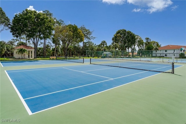 view of sport court with basketball hoop