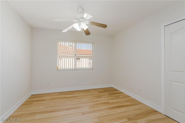 spare room with ceiling fan and light hardwood / wood-style flooring