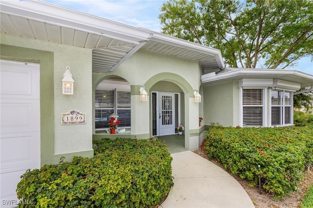 property entrance featuring a garage