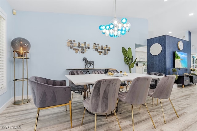 dining room with a notable chandelier and hardwood / wood-style floors