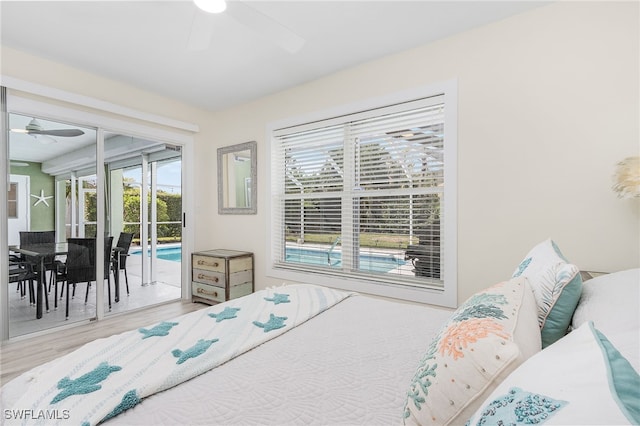 bedroom with wood-type flooring, ceiling fan, and access to outside